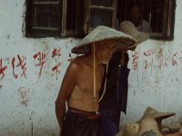 China 1988 market Caicun, Dali, scared child